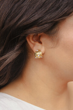 close up of brides gold earring