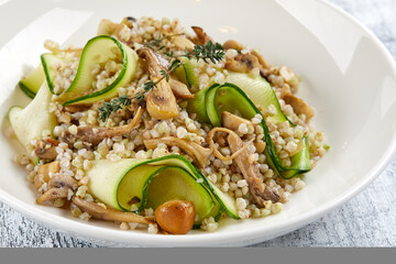 burley with fresh vegetables on white plate