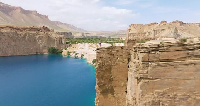 Aerial View Of Man On Top Of A Cliff In Band-e Amir National Park In Bamyan Province Of Afghanistan - Drone Shot
