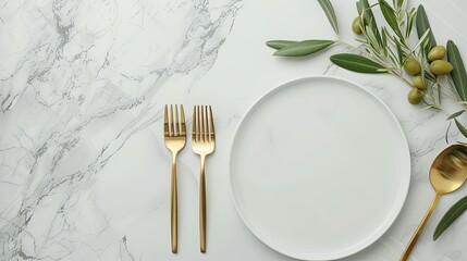 A white marble tabletop with a white plate, gold fork, gold knife, and gold spoon. An olive branch with green leaves extends from the left side of the frame