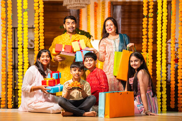 Indian family with kids celebrating rakhi or rakshabandhan festival or diwali