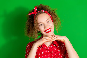 Photo portrait of attractive young woman demonstrate face toothy smile dressed stylish red retro clothes isolated on green color background