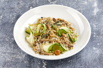 burley with fresh vegetables on white plate
