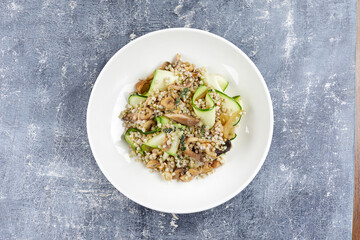 burley with fresh vegetables on white plate