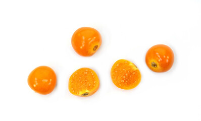 Uchuva (golden berry) delicious fruit isolated on white. Cape gooseberries in a wooden bowl. Fresh fruits of Physalis peruviana, also known as golden, inca and ground berry, uchuva, poha