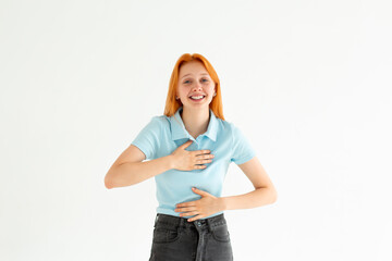 Portrait of extremely happy girl in blue t-shirt holding her stomach and chest and laughing out loud, chuckling giggling at amusing anecdote, sincere emotion. isolated on white background