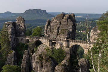 Fototapeta premium Landscape shot in the morning in a rocky landscape. On and around the Bastei Bridge in the Elbe Sandstone Mountains near Dresden, Saxony, Germany