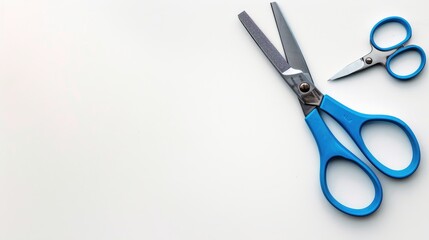 Blue handled school scissors on white background Central layout Overhead view with space for text