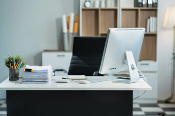 workspace area with laptop tablet smartphone and paperwork on the table in the office concept.