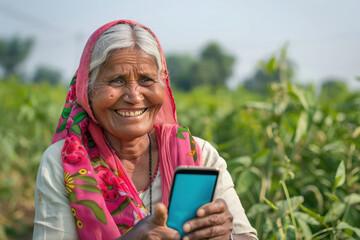 senior indian rural woman using smartphone