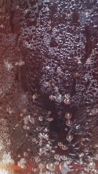 Soft drink in the glass with bubbles. Sweet wine is ready to serve in the club bar. Eye soothing intro clip for cold drink advertising and branding. Opening for tv commercial and billboard advertising