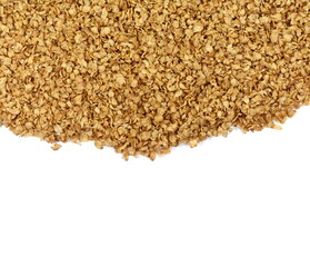 Buckwheat flakes spoon isolated on white background. Healthy buckwheat flakes. Healthy food.