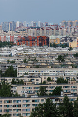 Modern multi-storey residential building is modern. Panel brick high-rise building in a green area of the old town. Top view on a sunny day. concept of real estate rental construction. Housing stock