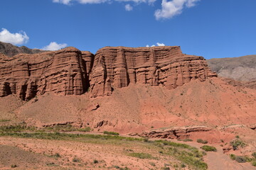 The red sandstone cliffs, canyons and valleys of Kyrgyzstan in Central Asia