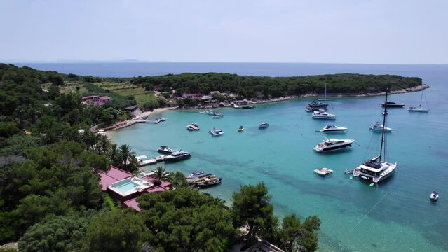 Bay with sailing boats and yachts on the Croatian coast at island of Palmizana 