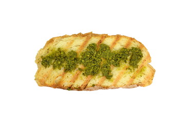 Bruschetta with pesto isolated. Toasted bread with a green basil pesto isolated on white background.