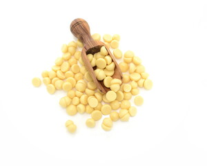 Organic cocoa butter buttons (wafers) isolated on white background