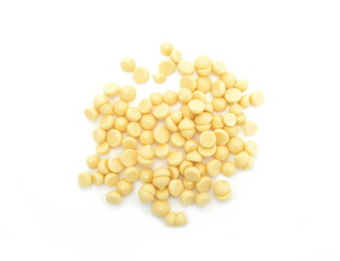 Organic cocoa butter buttons (wafers) isolated on white background