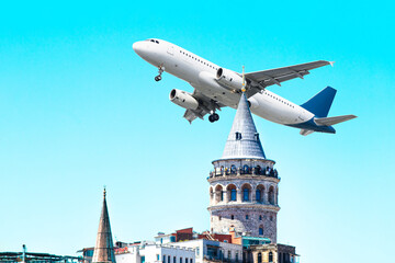 Galata Tower and passenger plane in front of blue sky. Tourism destination Istanbul. Airline travel...