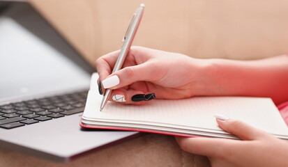 woman study hard write down information to notebook education concept