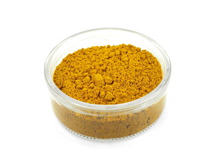 curry powder in a flass bowl isolated on white background