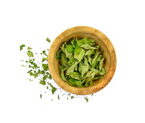 Dried curry leaves isolated on white background. Karivepaku or karuveppilai podi. Karapincha chips. curry leaves chips, coarse cuts. 