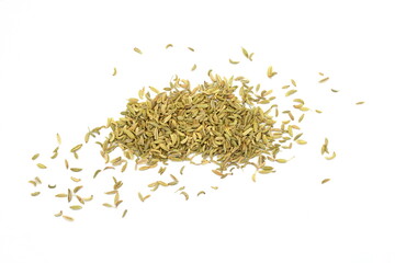 Fennel seeds spilled on a white background