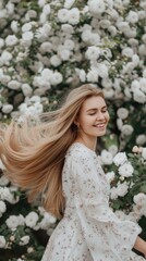 Naklejka premium A young woman with long blonde hair smiles warmly as she stands surrounded by blooming flowers, her floral dress complementing the vibrant blossoms