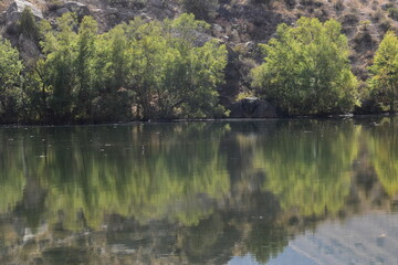 The stunning turquoise lake Iskanderkul and surrounding mountains and valleys in Tajikistan, Central Asia