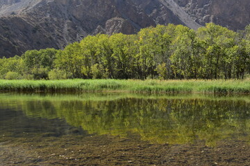 The stunning turquoise lake Iskanderkul and surrounding mountains and valleys in Tajikistan, Central Asia