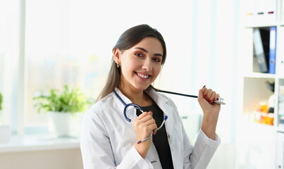 Beautiful smiling female doctor at workplace portrait. Physical and disease prevention patient aid...