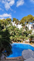 Luxury hotel by the turquoise and azure blue waters of Mallorca in the Spanish Mediterranean Sea