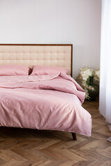 Morning messy on bed and pink cotton textile room
