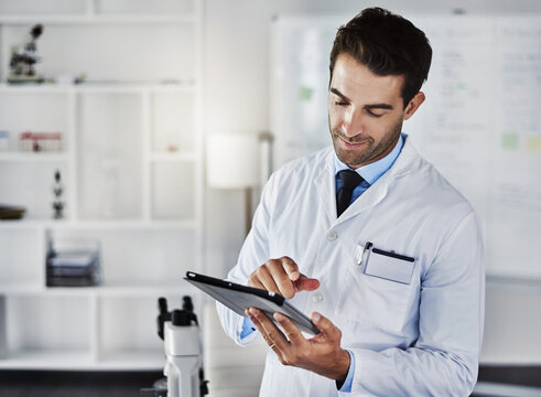 Medical, tablet and scientist man in laboratory for research, data analytics and reading experiment test results. Male doctor, digital and online report, information and manufacturing vaccine process