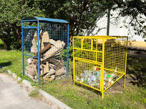  Metal mesh separate container for collecting plastic bottles for recycling. The concept of the fight against environmental pollution and global warming.