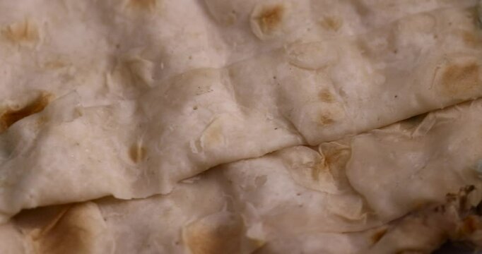 a spoiled wheat flour tortilla covered with mold, baked pita bread in mold