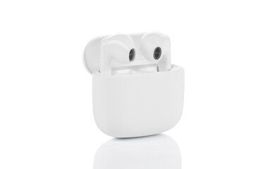 White headphones wireless earphones with case isolated on white background with clipping path.
