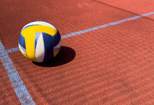 Volleyball ball on an outdoor court.