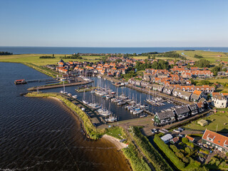 Fototapeta premium Aerial drone photo of the town and marina in Marken, an island in the Markermeer the Netherlands