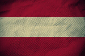 Austria nation flag on crumpled fabric background , country flag