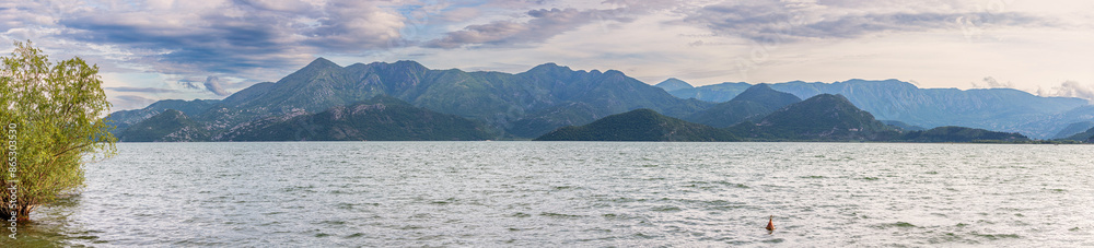 Wall mural explore the breathtaking landscape of montenegro's skadar region, where the picturesque lake shore a