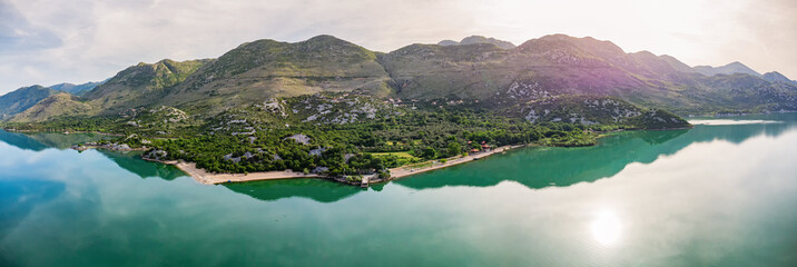 Scenic panorama of Skadarsko Lake with tranquil water and a picturesque sunrise