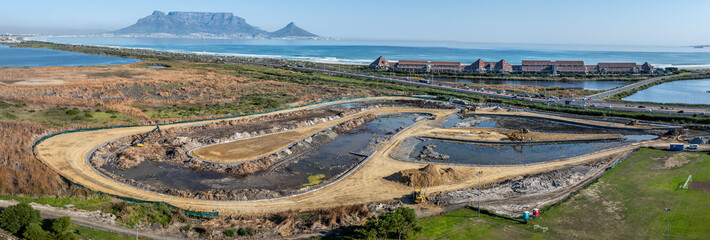 Wetlands construction of sedimentation ponds and reed beds to clear storm runoff water from...