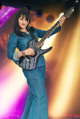 Fototapeta premium Woman Playing Guitar with Lights Background