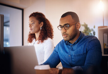 Business people, night and cooperation with laptop, research for article, creativity and internet in modern office. Employees, consultant or journalist with computer, editing and deadline for project