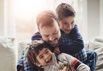 Funny, home and father with boys, family and laughing in living room for fun, happiness and bonding...