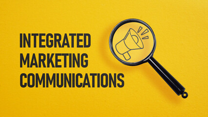 Integrated marketing communications IMC is shown on the business photo using the text