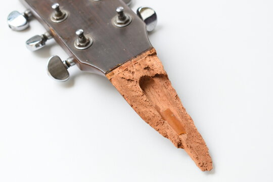 recommend clip art: part of broken wood acoustic guitar isolated on white background