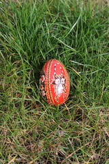 Traditional hand-dyed colourful Easter eggs in Poland called pisanka or kroszonka in green grass