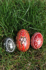 Traditional hand-dyed colourful Easter eggs in Poland called pisanka or kroszonka in green grass